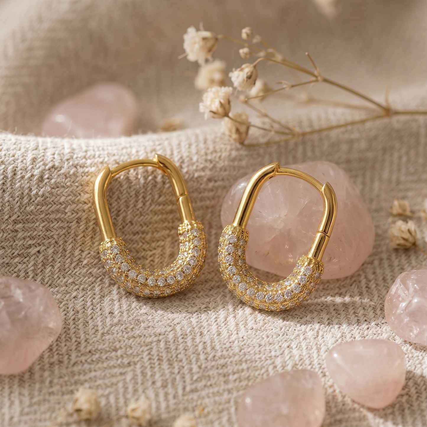Front view of elegant Ada Hoop Earrings crafted from S925 sterling silver with luxurious 18K gold plating, featuring an elongated oval silhouette and sparkling micro-set zircon pavé detailing. These hypoallergenic gold hoop earrings combine vintage-inspired glamour with modern sophistication, making them the perfect statement jewelry for everyday wear, special occasions, or timeless gift giving. Inspired by the refined craftsmanship and product details from L’arisses.
