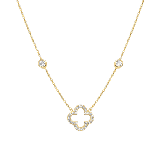 Close-up of the clover pendant crafted from sterling silver, 14K gold plated, and set with sparkling zircon stones. A fine jewelry necklace designed for elegant everyday wear.