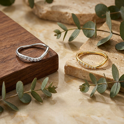 Lifestyle image showing the Alice ring stacked with complementary rings for a layered, modern aesthetic.