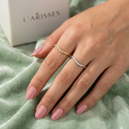 Lifestyle image showing the Alice ring stacked with complementary rings for a layered, modern aesthetic.