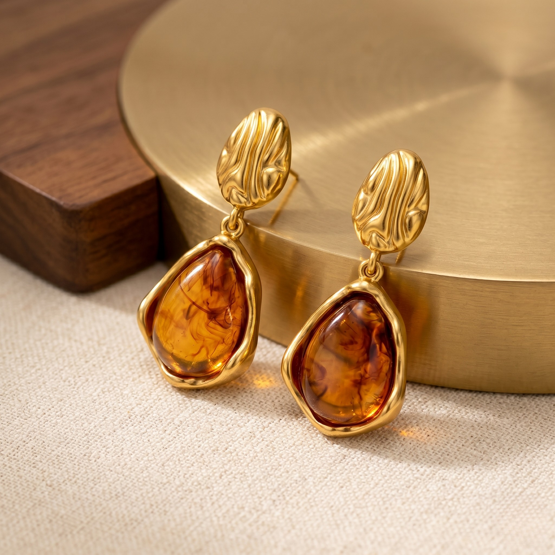 Elegant lifestyle portrait showcasing the Ella vintage earrings worn by a model, featuring 18k gold-plated stainless steel detailing with warm amber-inspired stones. This styled product image highlights the earrings’ refined proportions, timeless vintage charm, and sophisticated everyday elegance.