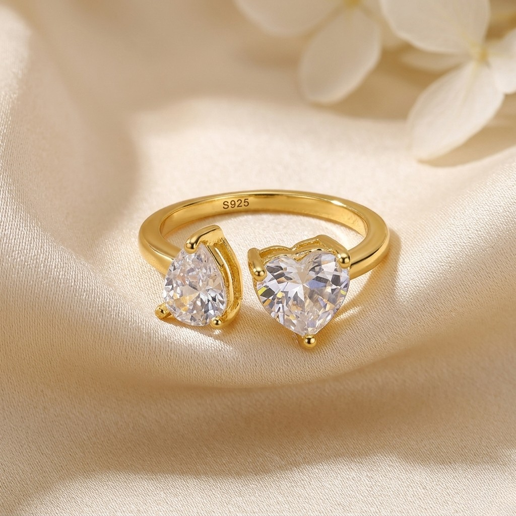 Elegant 14K gold plated sterling silver open ring featuring a sparkling heart-cut zircon and pear-cut zircon design. This romantic adjustable statement ring blends modern sophistication with timeless charm, creating a luxurious fine jewelry look perfect for everyday elegance, special occasions, or meaningful gifts.