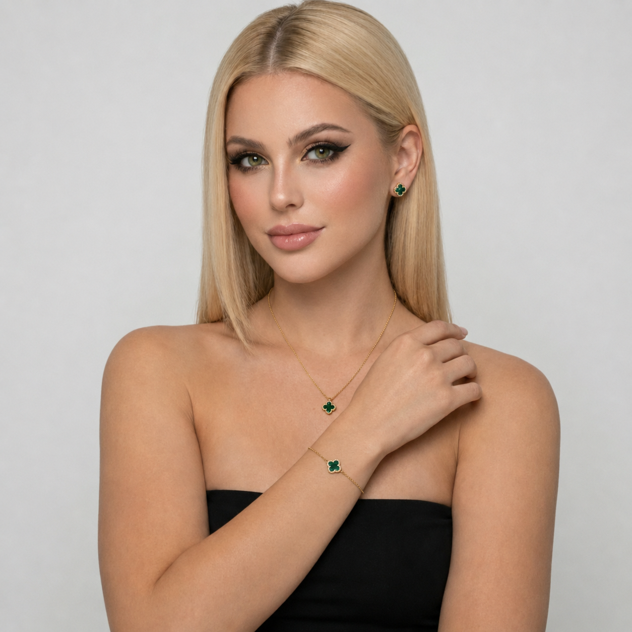 Green malachite clover jewelry set with necklace, bracelet, and stud earrings made from S925 sterling silver and 18K gold plating. Luxury clover jewelry set with sparkling zircon stones.