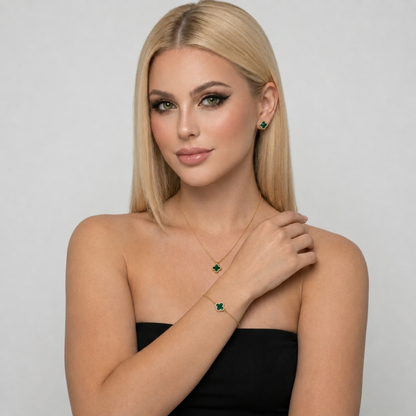 Green malachite clover jewelry set with necklace, bracelet, and stud earrings made from S925 sterling silver and 18K gold plating. Luxury clover jewelry set with sparkling zircon stones.