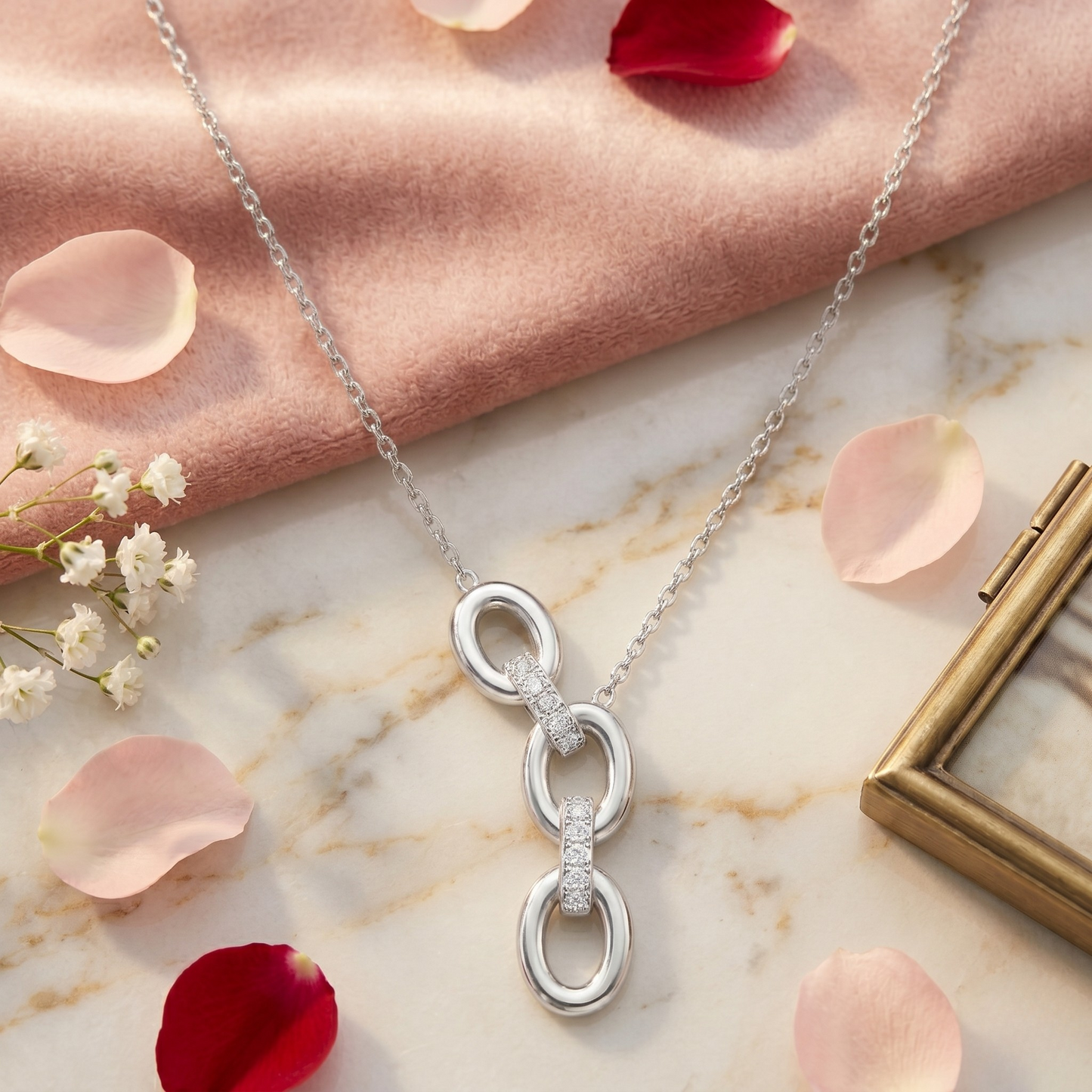 Side angle view of the Lucy silver necklace highlighting its sleek interlocking design, sparkling zircon details, and rhodium plated sterling silver craftsmanship for chic everyday jewelry.