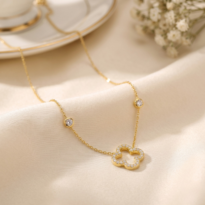Front view of the sterling silver necklace featuring a 14K gold plated clover pendant fully set with brilliant zircon stones and accented chain details. A timeless fine jewelry piece perfect for elegant everyday styling or special occasion wear.