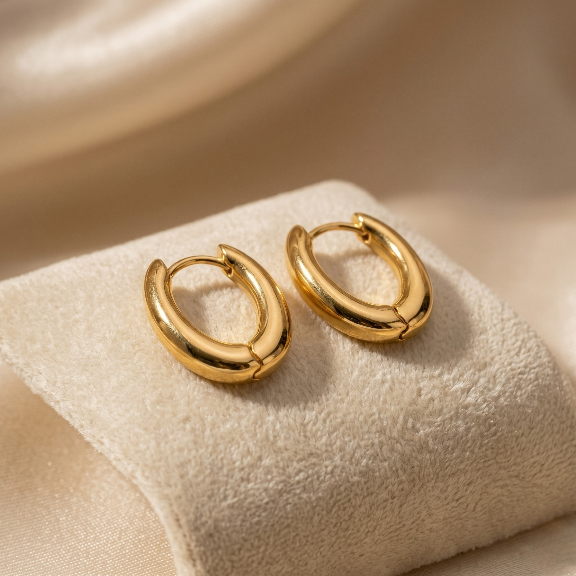 Elegant and timeless, the Mia Gold Huggie Hoop Earrings are crafted from premium S925 sterling silver and finished with luxurious 14K gold plating for a radiant shine. These sleek, polished hoops feature a classic chunky silhouette that adds effortless sophistication to both everyday wear and special occasions. Hypoallergenic, tarnish-resistant, and designed for lasting comfort, Mia earrings are the perfect minimalist jewelry essential for any collection.