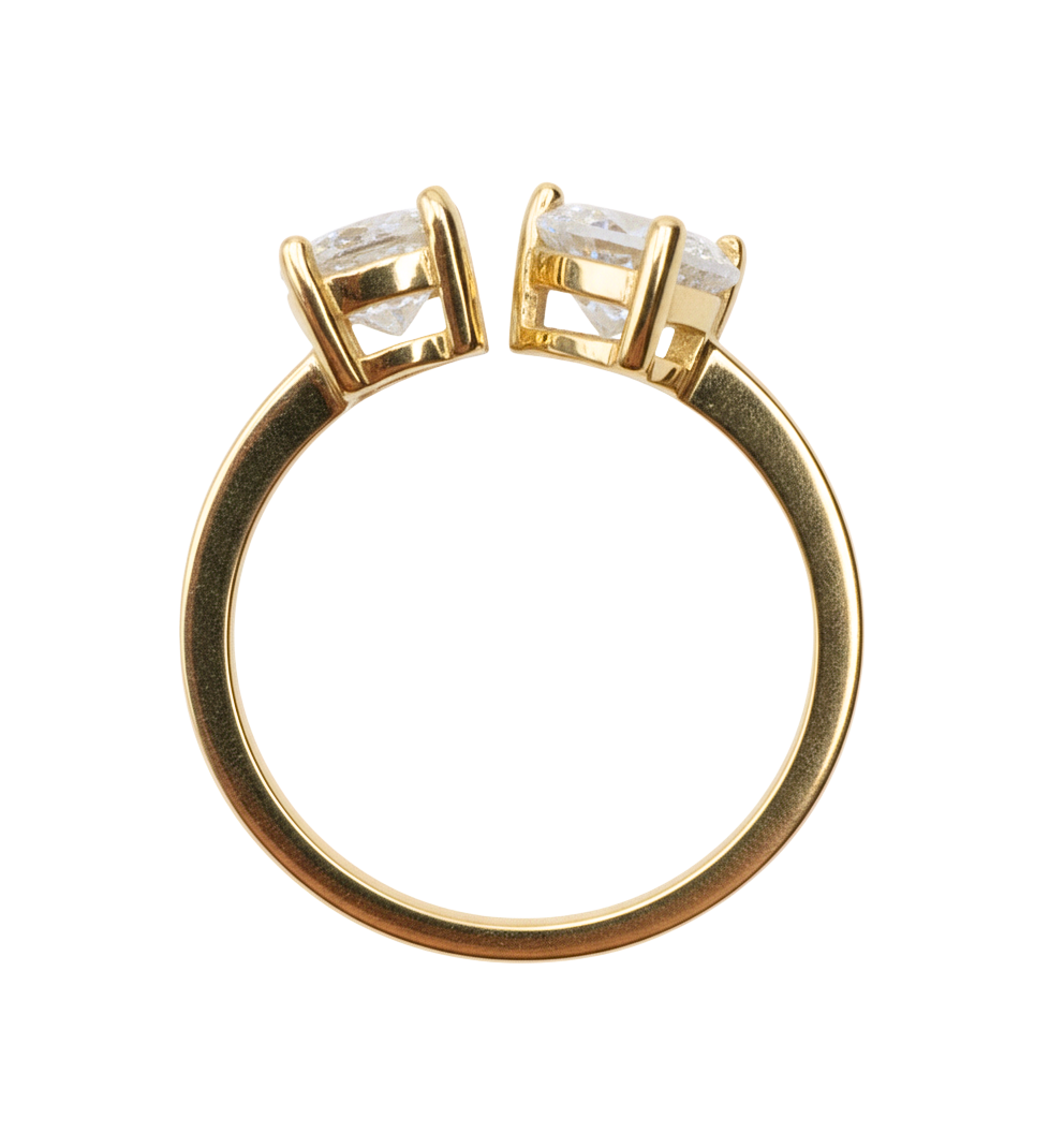 Close-up detail of the Natalie resizable ring highlighting the sparkling heart-cut and pear-cut zircon stones set in high-polish gold plated sterling silver.