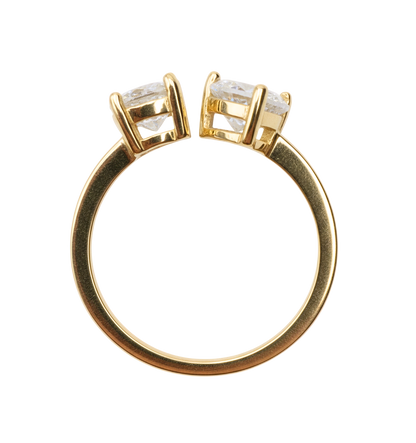 Close-up detail of the Natalie resizable ring highlighting the sparkling heart-cut and pear-cut zircon stones set in high-polish gold plated sterling silver.