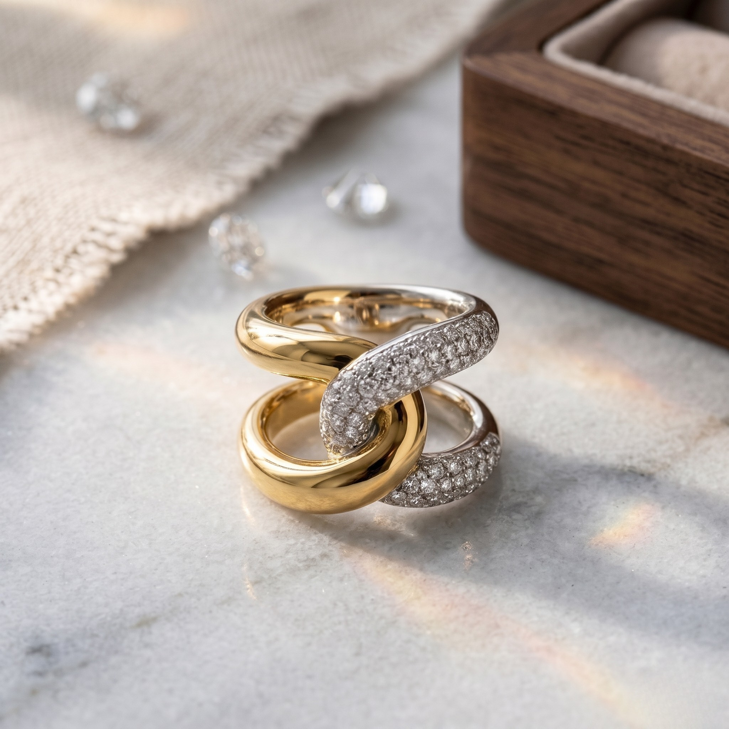 Side perspective highlighting the sculptural crossover design and high-polish 18K gold plated finish.