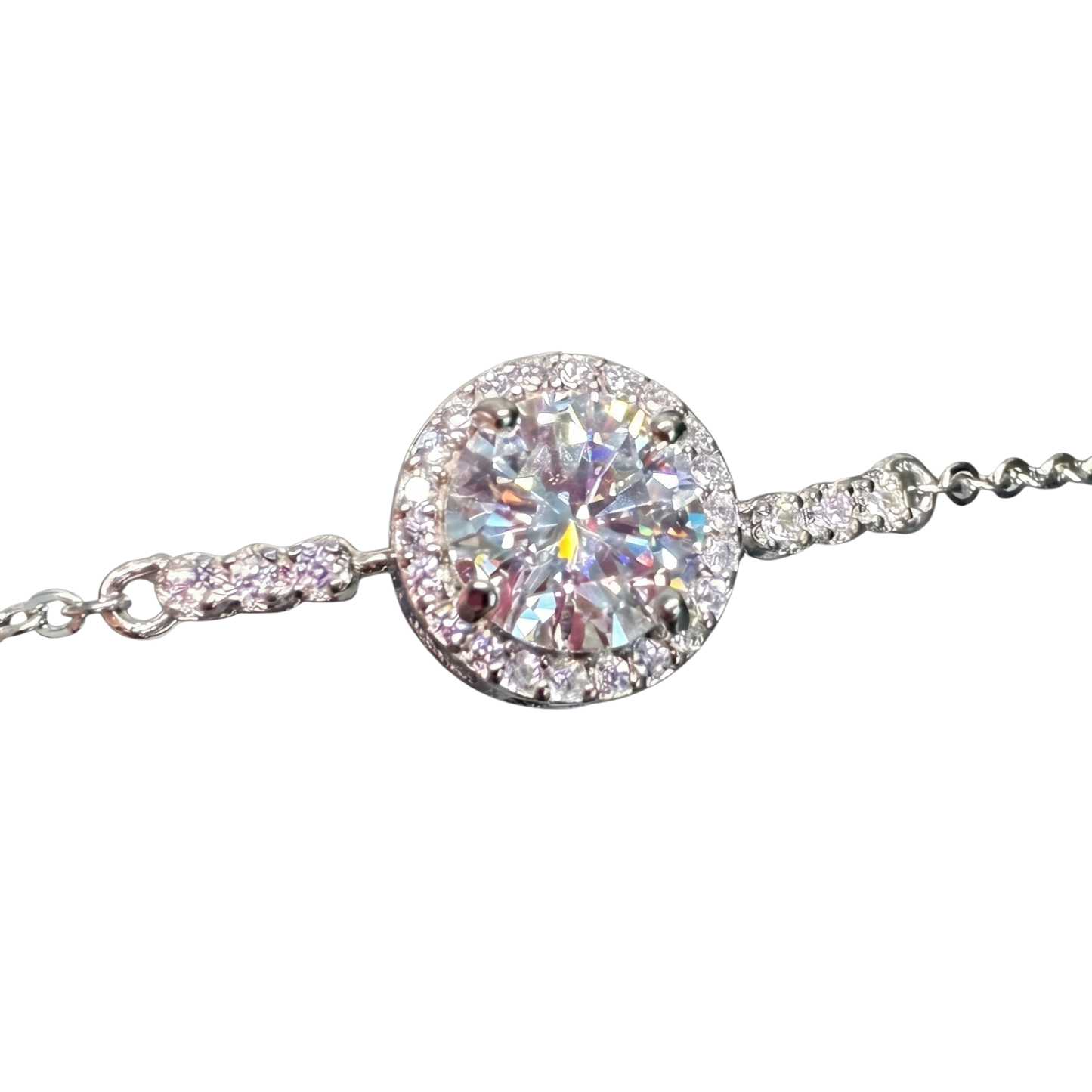 Close-up of the 1 carat moissanite stone showcasing exceptional VV1/VV2 clarity, D color brilliance, and fine halo craftsmanship in sterling silver.