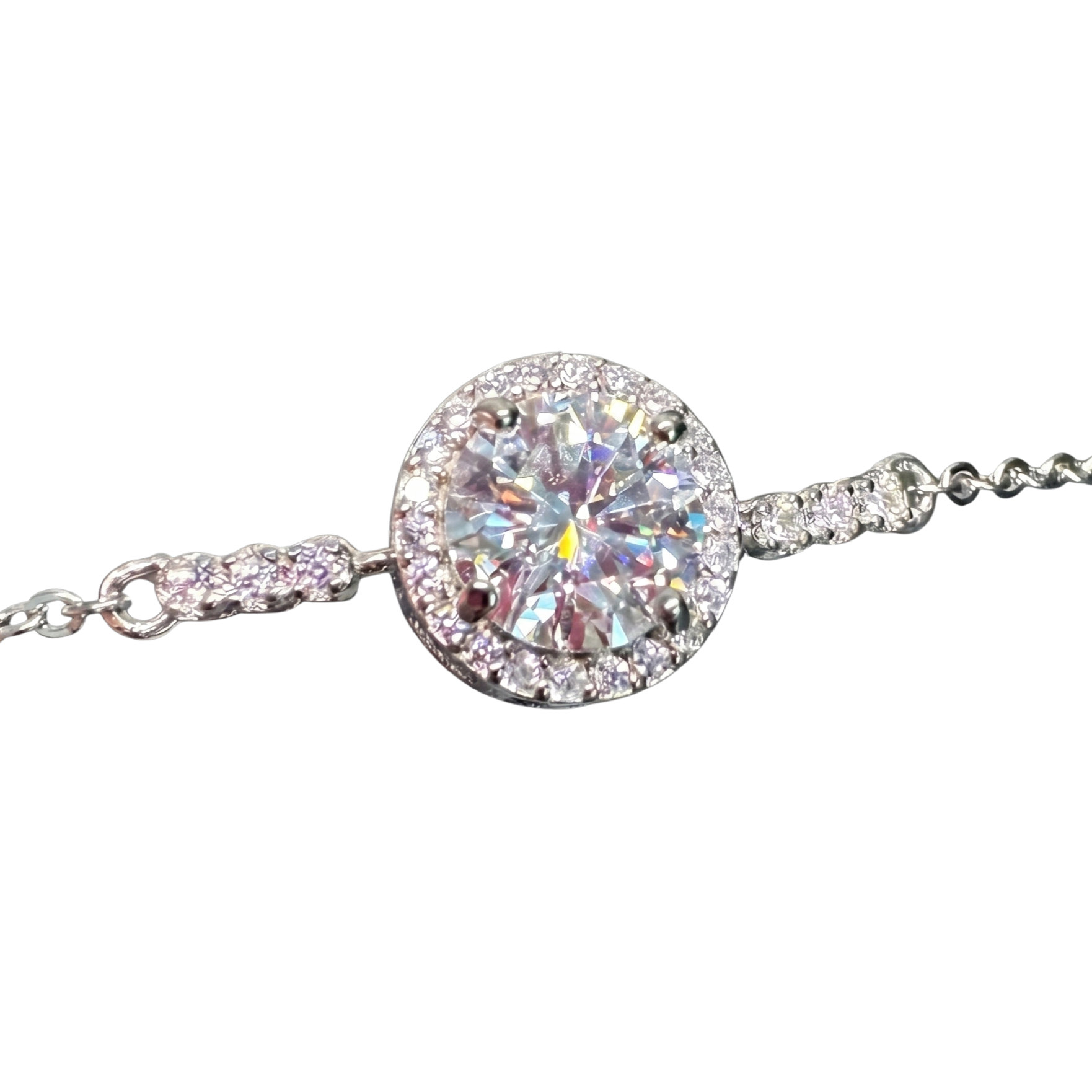 Close-up of the 1 carat moissanite stone showcasing exceptional VV1/VV2 clarity, D color brilliance, and fine halo craftsmanship in sterling silver.