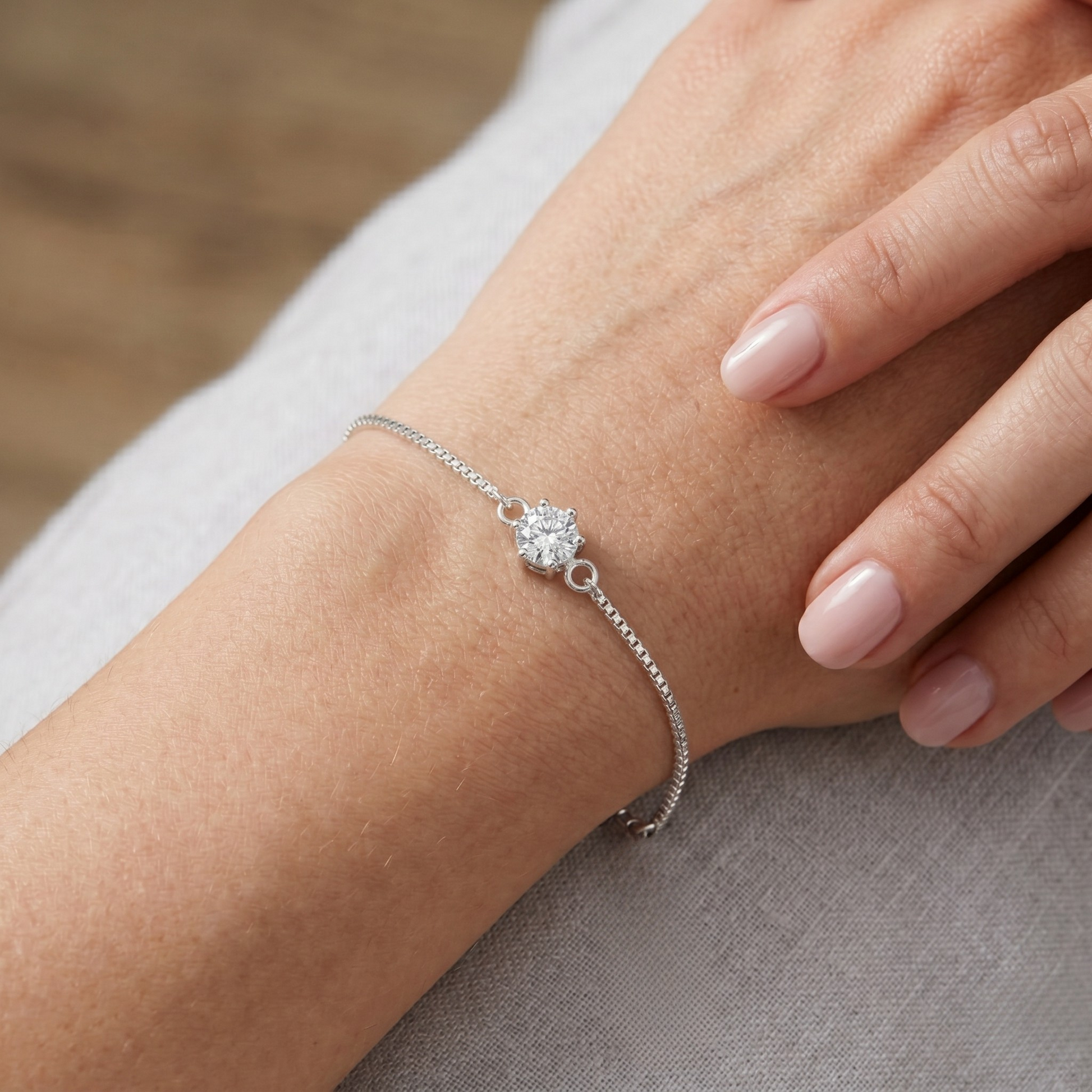 Elegant lifestyle image showing the delicate, stackable design of the Sanya sterling silver bracelet, perfect for everyday wear or special occasions.