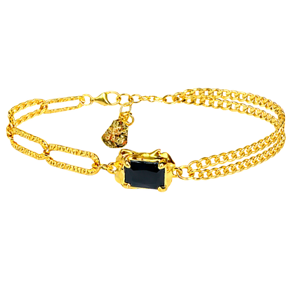 Close-up product shot showcasing the rectangular black onyx stone set in 18K gold plated sterling silver.