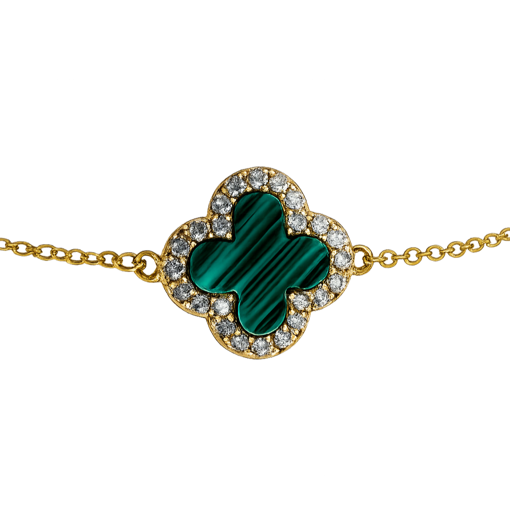 Close-up detail of the clover charm highlighting the polished 18K gold plating and brilliant zircon accents.