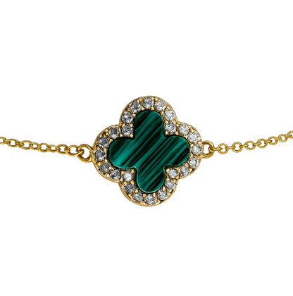 Close-up detail of the clover charm highlighting the polished 18K gold plating and brilliant zircon accents.