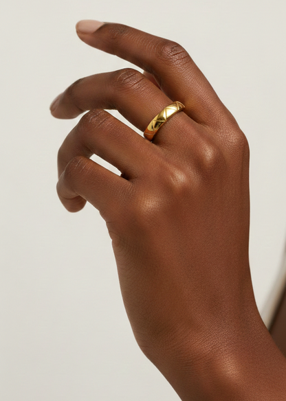 Macro shot displaying the smooth polished finish and detailed craftsmanship of the 18K gold plated surface.