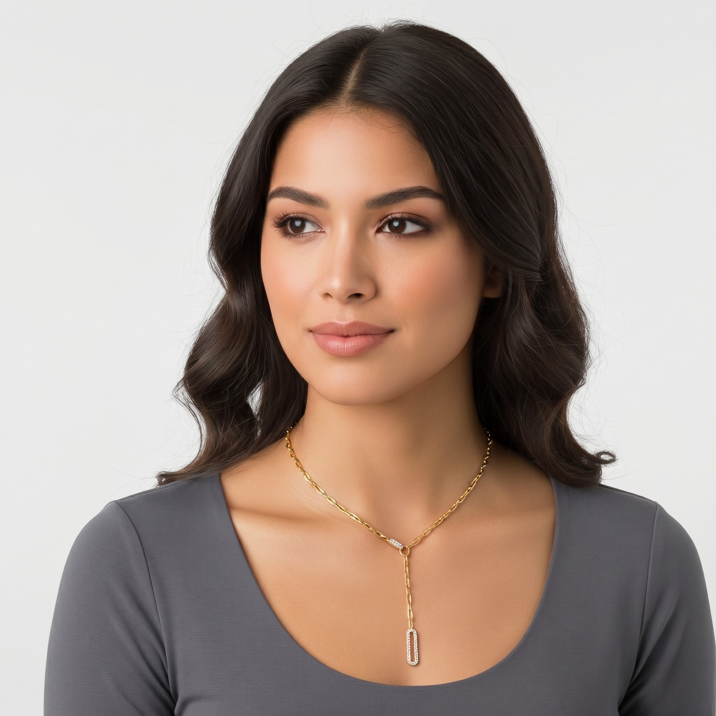 Detailed view of the zircon-studded drop pendant on the Tamara sterling silver necklace, finished in 14K gold plating. Delicate silver jewelry with brilliant sparkle.