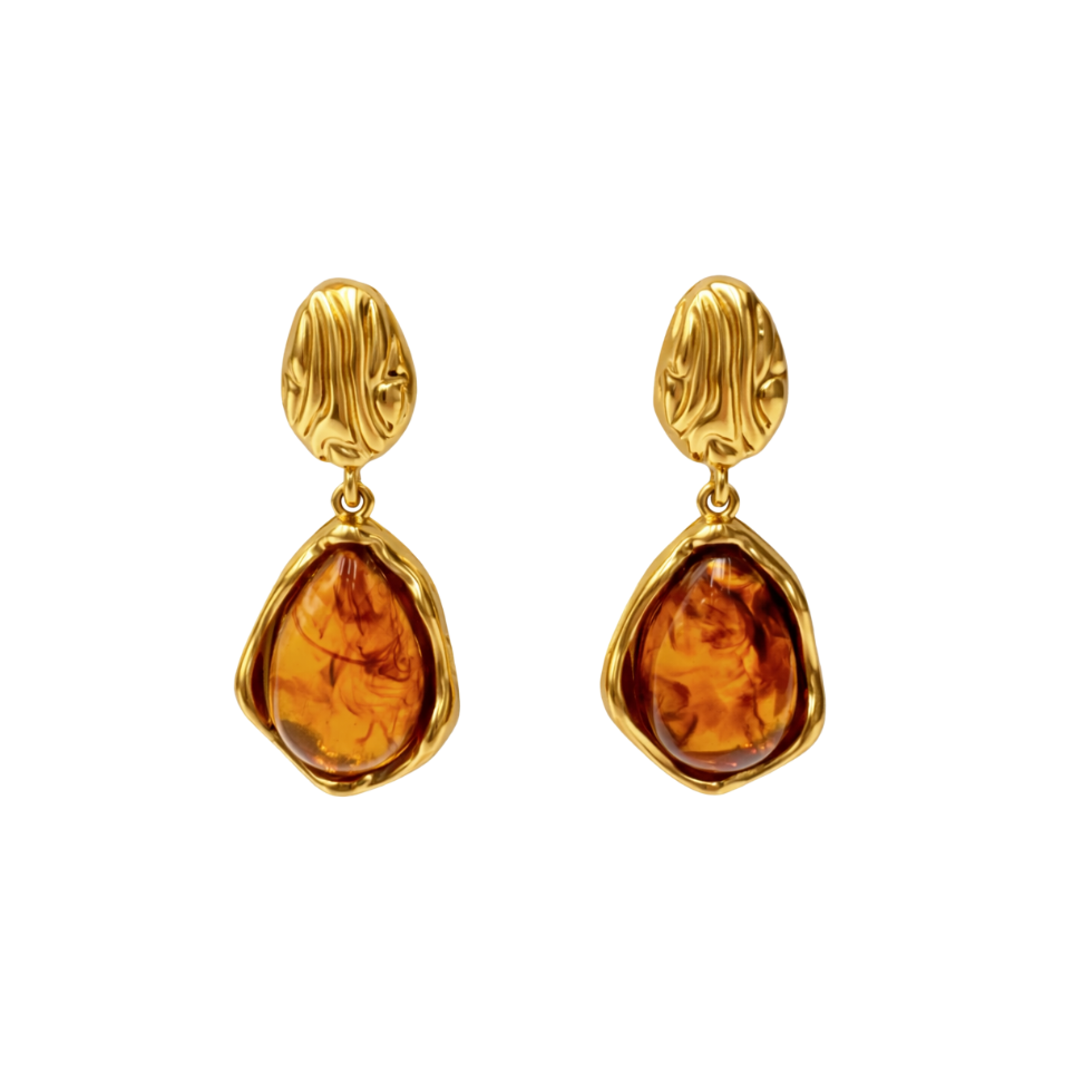 Close-up photo of elegant gold earrings crafted from stainless steel jewelry, featuring a warm vintage stone set in an organic gold frame, inspired by timeless vintage earrings design