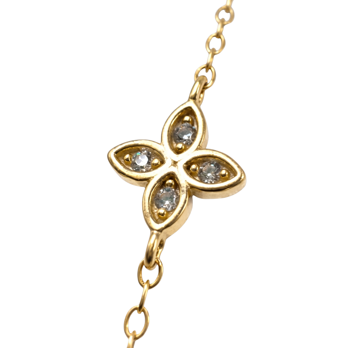 Close-up of delicate floral station details on this hypoallergenic gold plated silver bracelet.