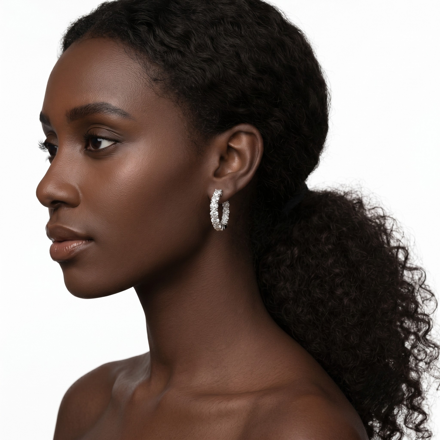 Detailed image of Amelia rhodium plated sterling silver earrings with hypoallergenic, tarnish resistant finish and sparkling moissanite stones.