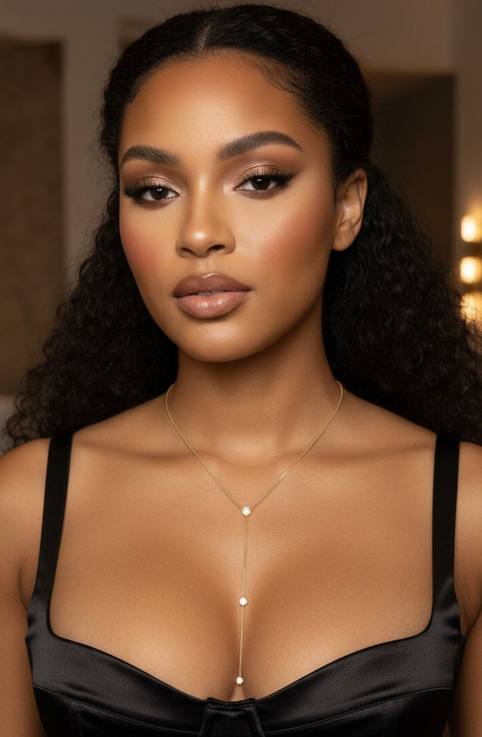 Side angle view of Angela sterling silver necklace with 14k gold plating, highlighting the elegant lariat drop and bezel set zircon stones fine jewelry design.