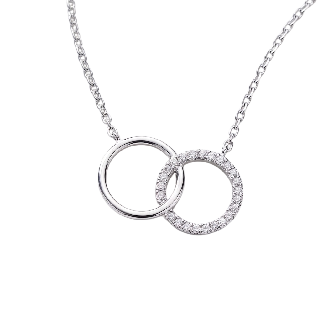 Close-up detail of zircon stones on rhodium plated sterling silver circle, highlighting sparkle and fine jewelry craftsmanship.