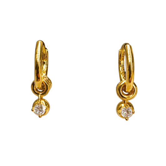 Close-up of 18K gold plated sterling silver earrings, highlighting the sculpted hoop texture and sparkling zircon charm.
