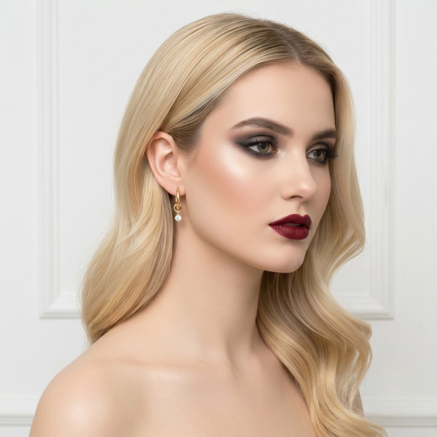 Detailed image of S925 sterling silver earrings with gold plating and zircon drop, emphasizing premium craftsmanship and minimalist fine jewelry style.