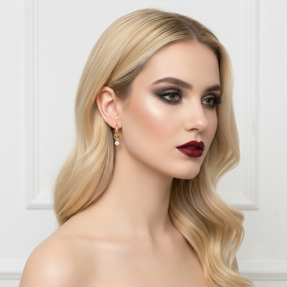 Detailed image of S925 sterling silver earrings with gold plating and zircon drop, emphasizing premium craftsmanship and minimalist fine jewelry style.