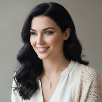 Elegant key and clover pendant crafted from sterling silver with 14k gold plating and sparkling zircon accents.