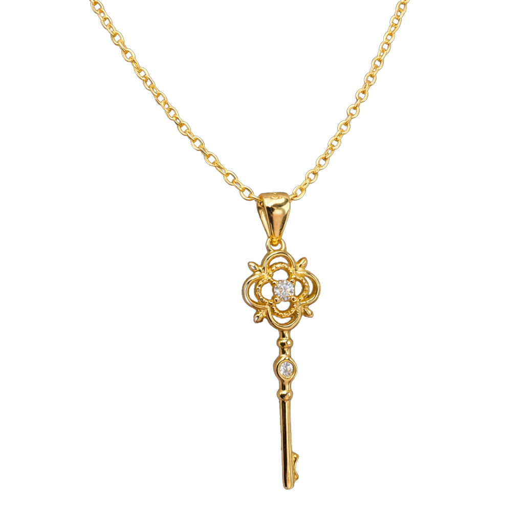Close-up detail of zircon stones on the clover and key pendant of this sterling silver 14k gold plated necklace jewelry.