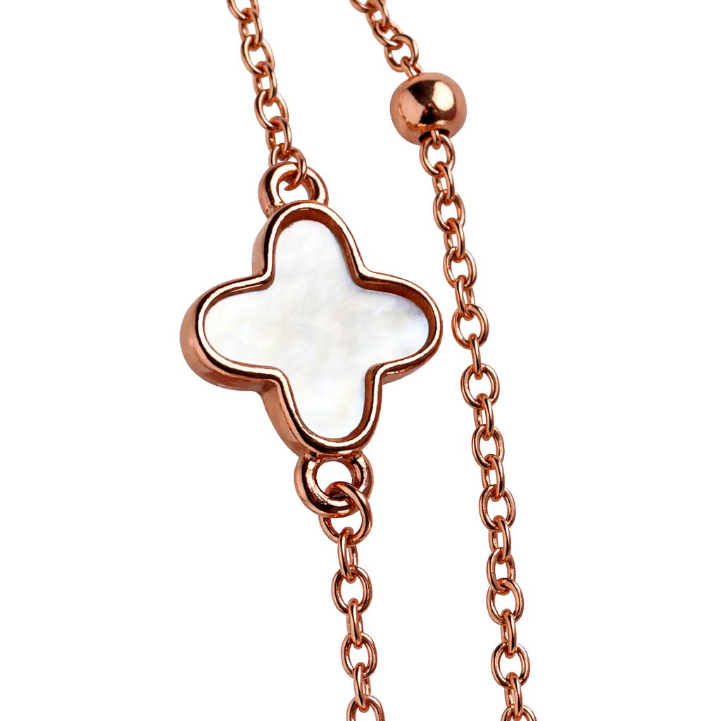 Close-up detail of hypoallergenic rose gold plated silver bracelet showcasing green stone and shell clover inlays.