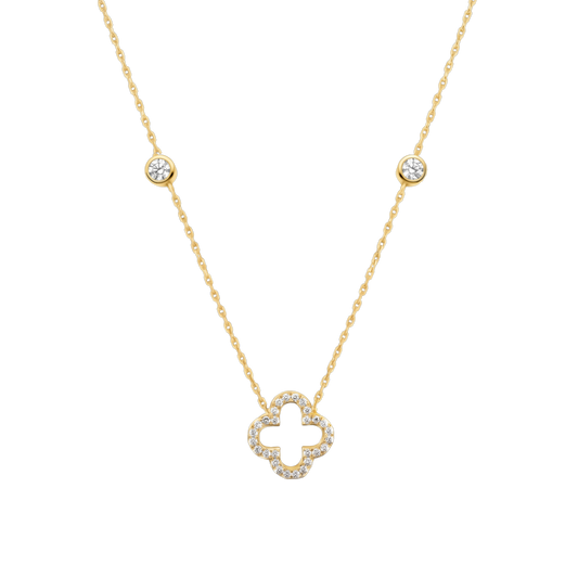 Close-up of the clover pendant crafted from sterling silver, 14K gold plated, and set with sparkling zircon stones. A fine jewelry necklace designed for elegant everyday wear.