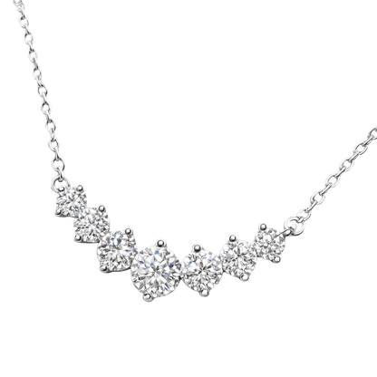 Close-up detail of moissanite stones on Liah sterling silver necklace, highlighting VVS1 clarity and D color brilliance in rhodium plated silver jewelry.