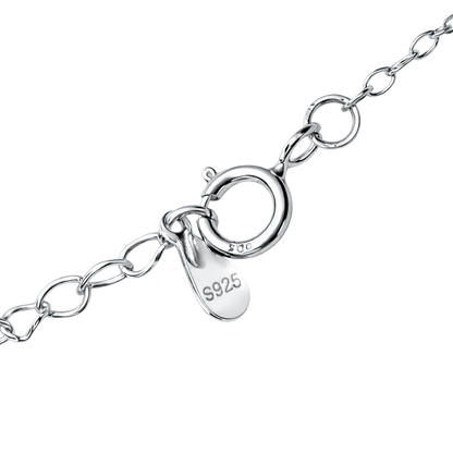 Side angle of sterling silver heart necklace highlighting fine jewelry craftsmanship, rhodium plated shine, and moissanite setting.