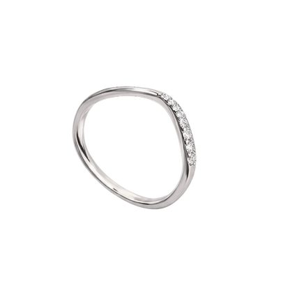 Macro shot focusing on the sparkling zircon stones set along the band.