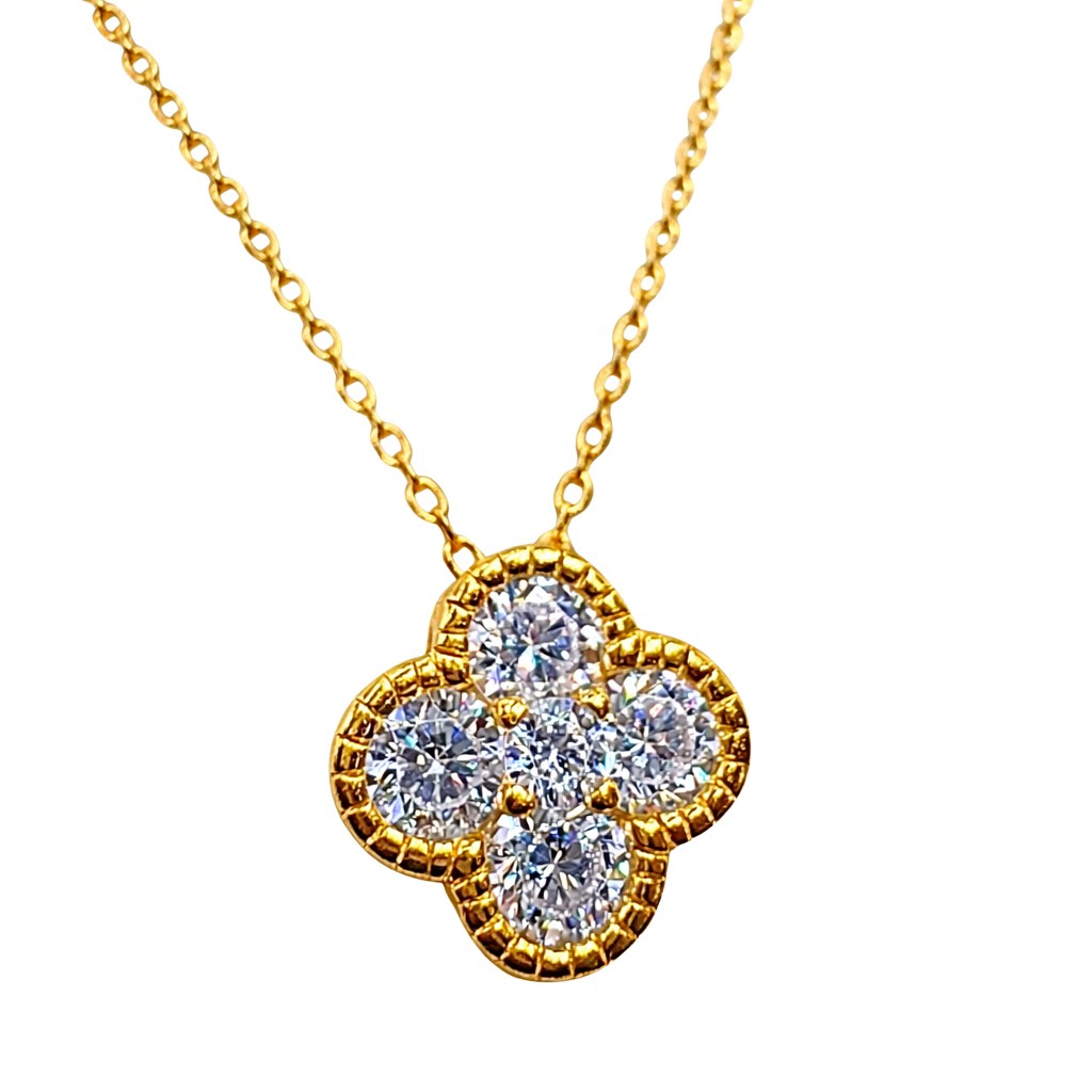 Close-up detail of four-leaf clover zircon pendant in 18k gold plated sterling silver S925, luxury fine jewelry look.