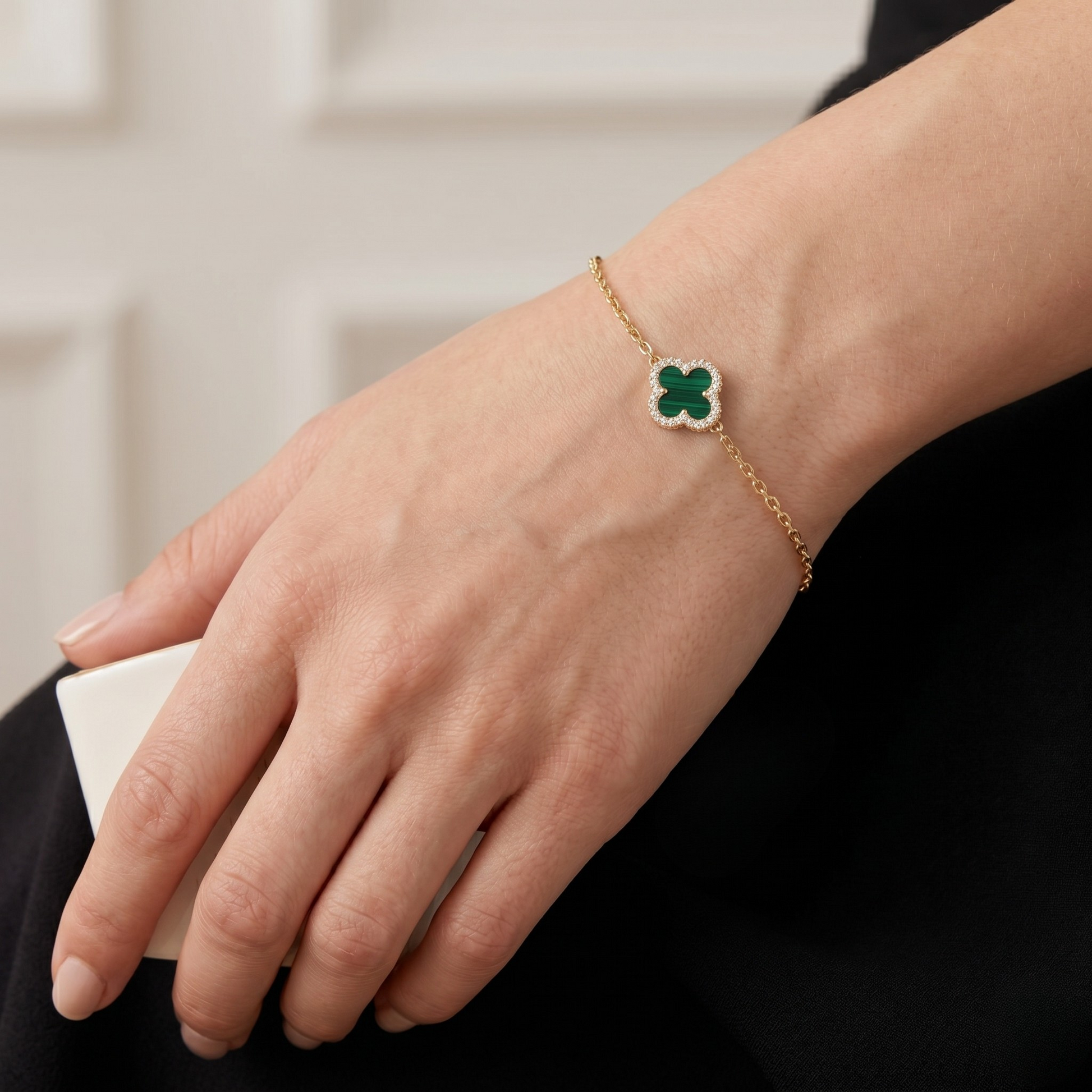 Green malachite clover jewelry set with necklace, bracelet, and stud earrings made from S925 sterling silver and 18K gold plating. Luxury clover jewelry set with sparkling zircon stones.