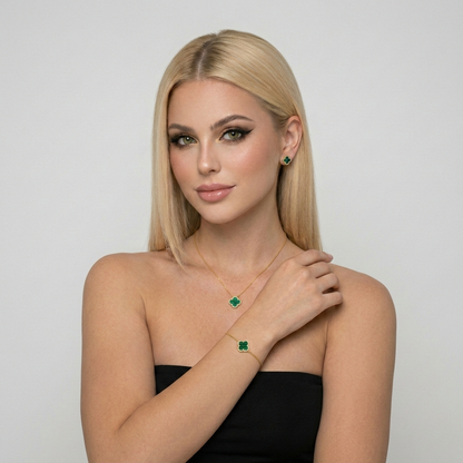 Green malachite clover jewelry set with necklace, bracelet, and stud earrings made from S925 sterling silver and 18K gold plating. Luxury clover jewelry set with sparkling zircon stones.