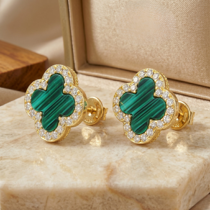 Pair of clover stud earrings crafted from sterling silver and gold plating, highlighting elegant proportions and luxury design.
