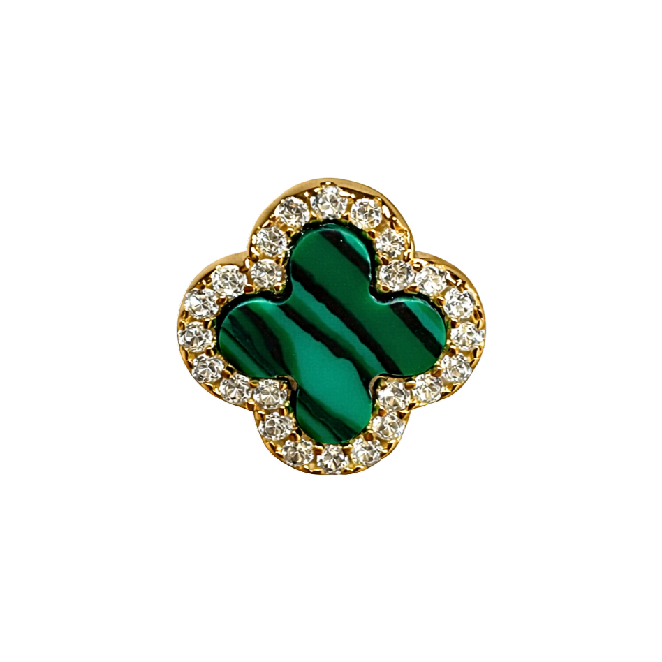 Close-up of malachite stone earrings surrounded by sparkling zircon, showcasing fine jewelry craftsmanship and rich green tones.