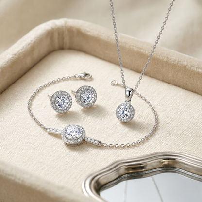 Sterling silver moissanite jewelry set including halo necklace, bracelet, and stud earrings. Features D color VVS1 moissanite stones with brilliant sparkle in a matching luxury set.